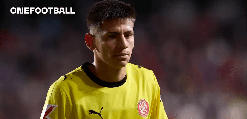 Goalkeeper in yellow jersey walking off the field