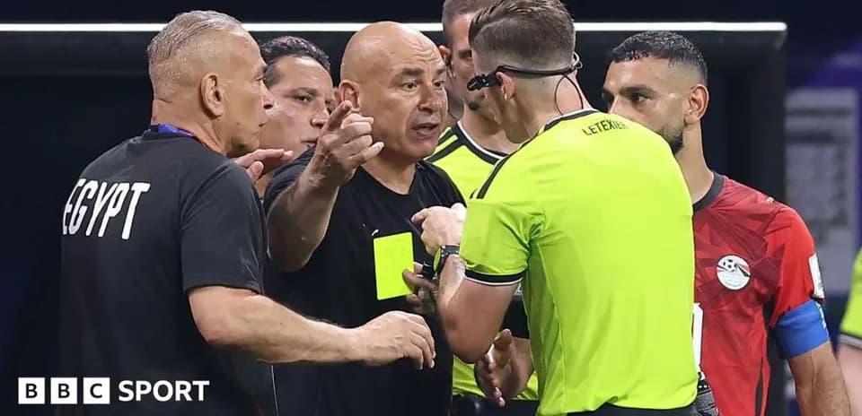 Coach discussing with referee during match controversy