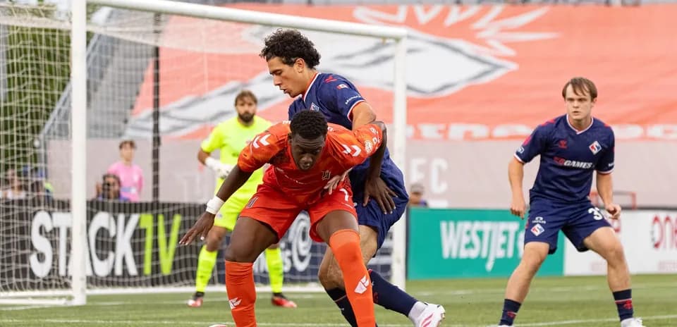 Players contesting the ball during match