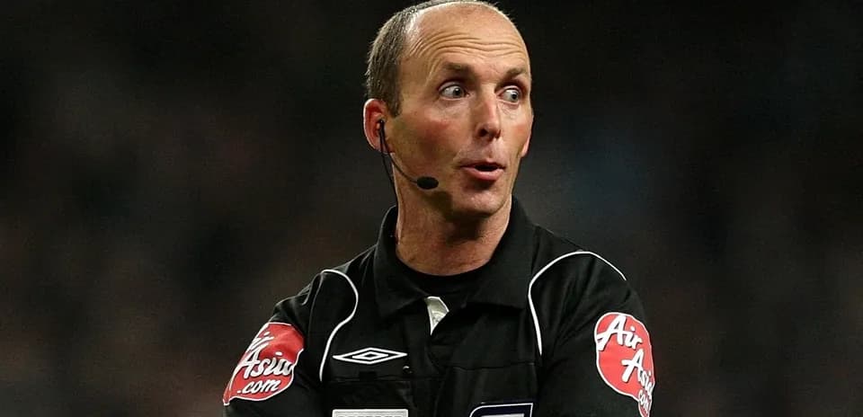 Referee signaling during a football match