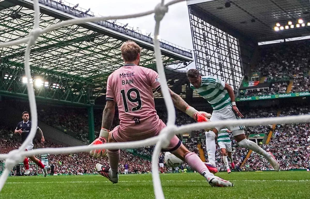 Goalkeeper blocking shot during Celtic match