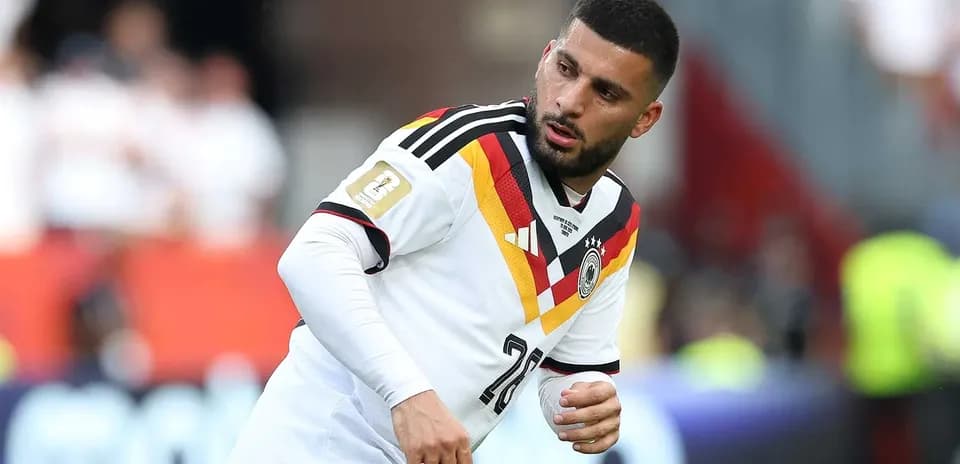 Player in Germany jersey warming up on field