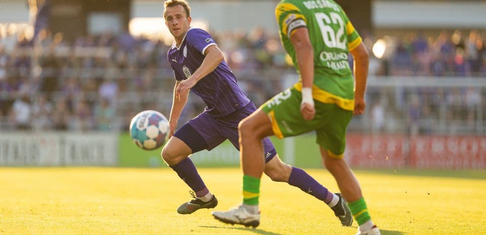 Player passing the ball during Louisville City match
