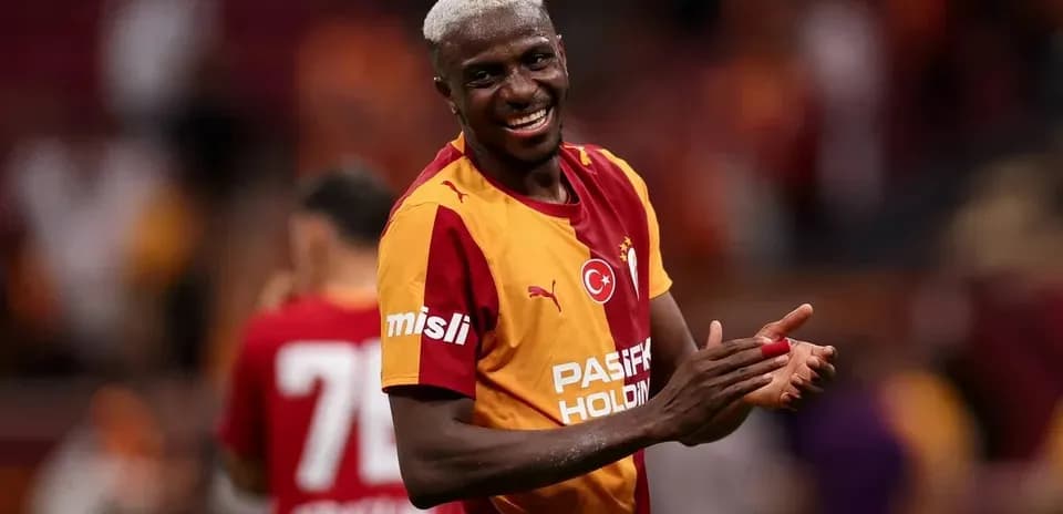 Player celebrating in Galatasaray jersey after match