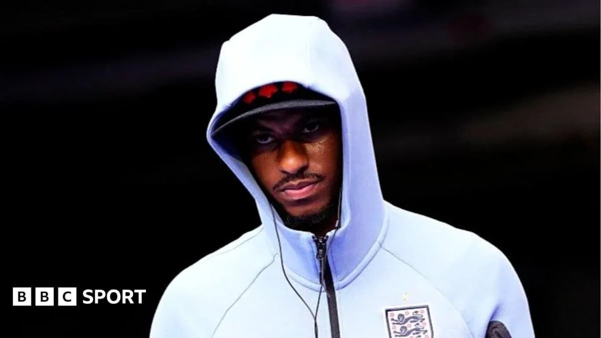 Player wearing a hooded sweatshirt before match