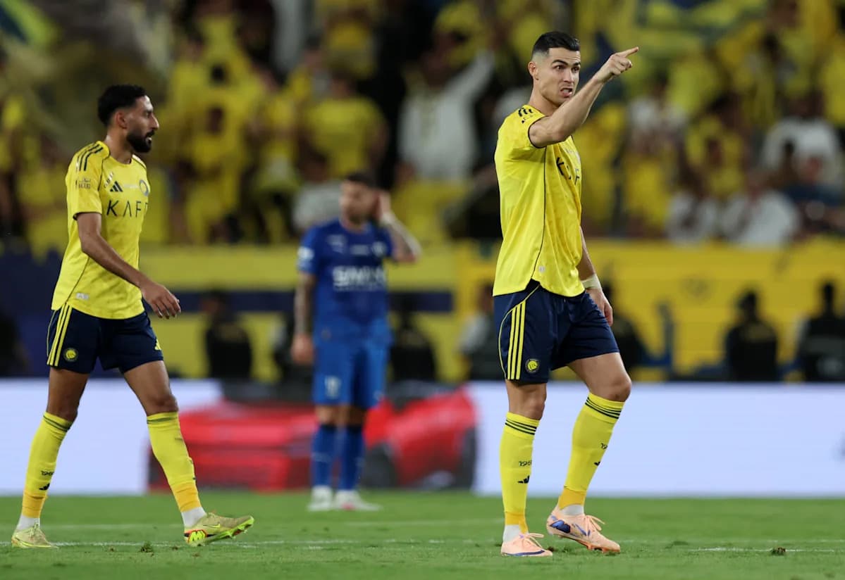 Two players in yellow kits during match action