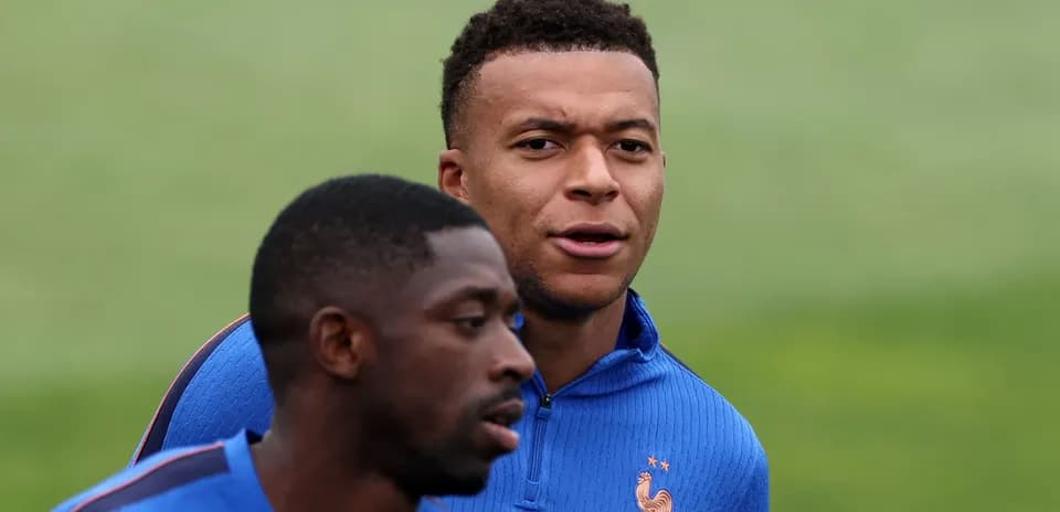 Two players training in France national team uniforms