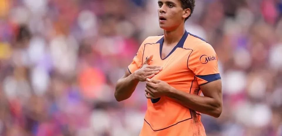 Player in orange jersey during match action