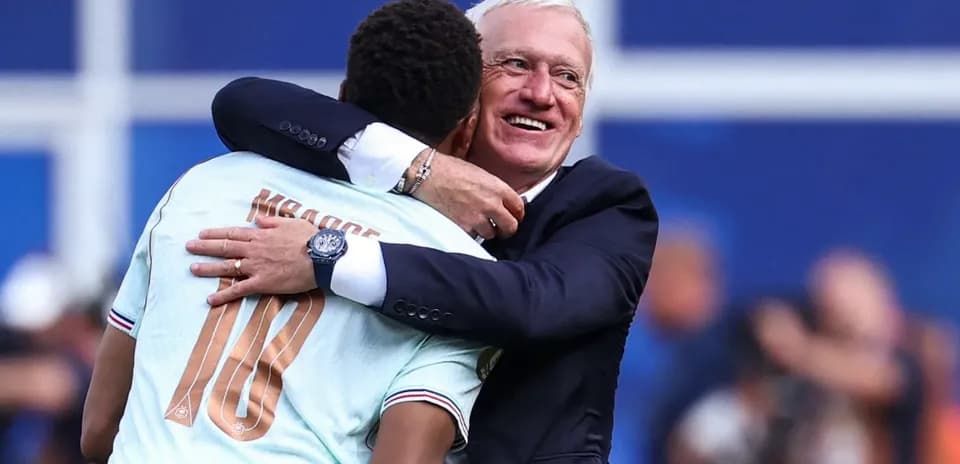 Player and coach embracing after match victory