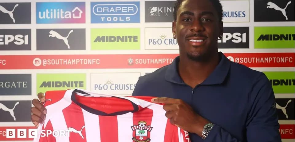 Player holding Southampton FC jersey at press event