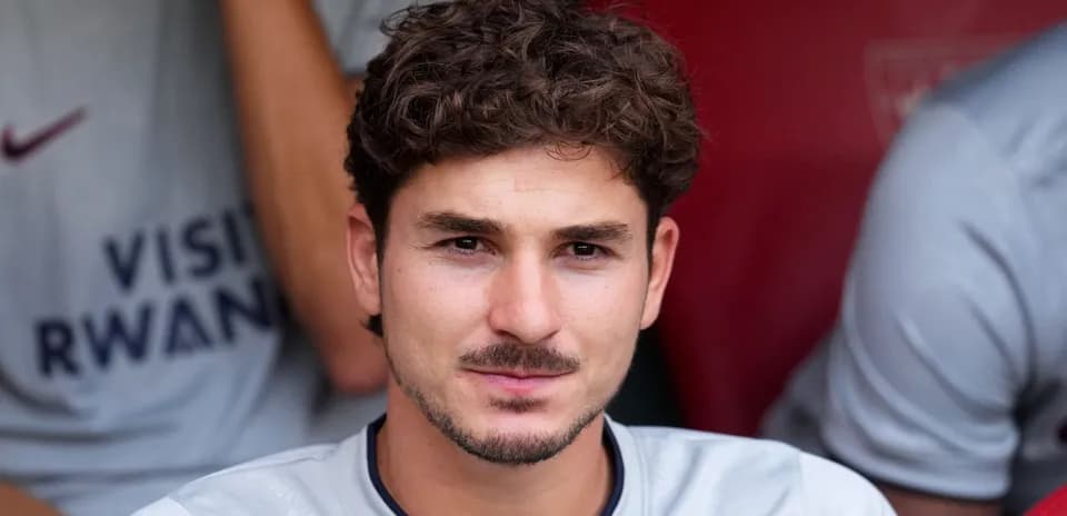 Player sitting on bench during match preparation