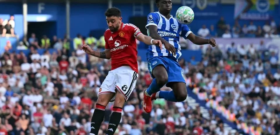 Player from Manchester United and Brighton contesting ball