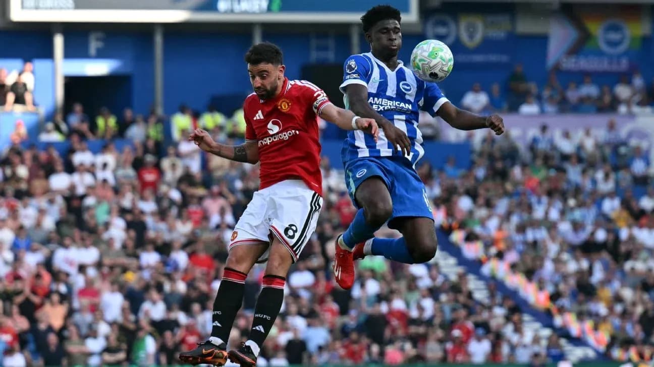 Player from Manchester United and Brighton contesting ball