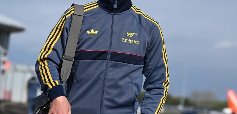 Man in sportswear walking with bag