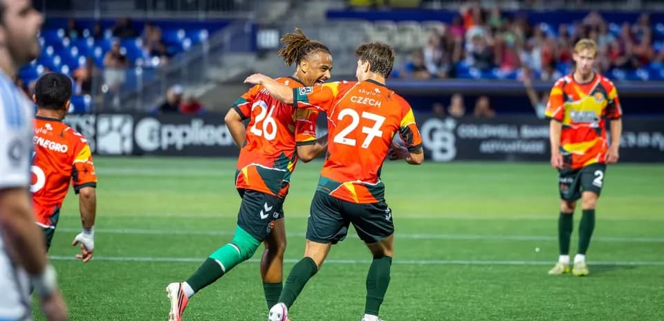 Players celebrating a goal during the match