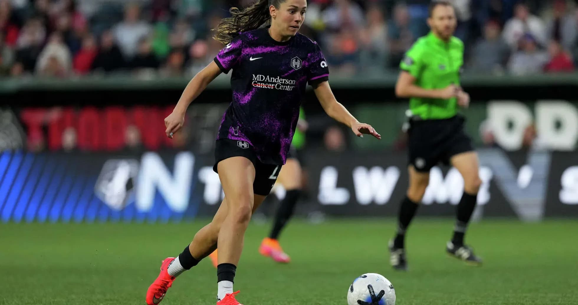 Player dribbling the ball during NWSL match