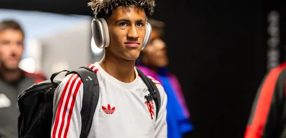 Player wearing headphones entering locker room