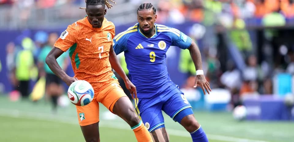 Two players competing for the ball during match
