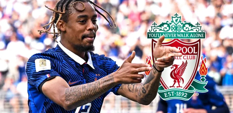 Player celebrating on the field with Liverpool logo