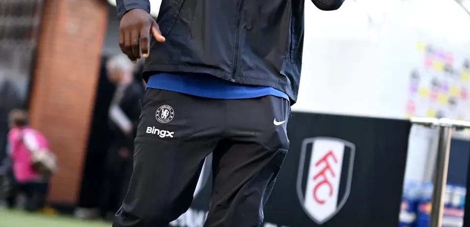 Player walking in Chelsea training gear before match