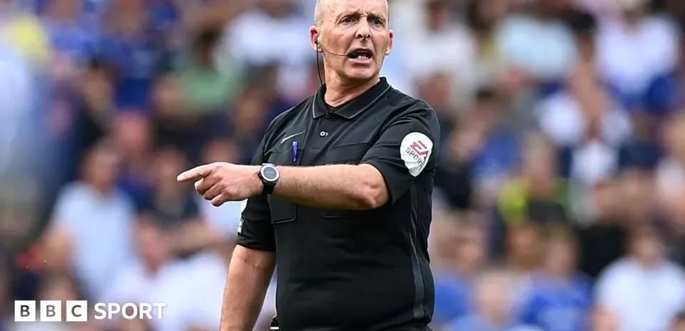 Referee giving instructions during a football match