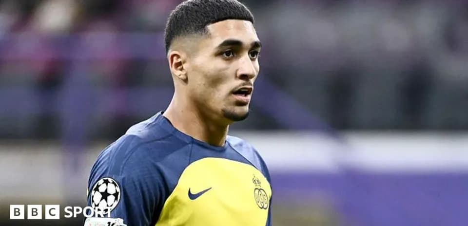 Player in training kit during match warm-up