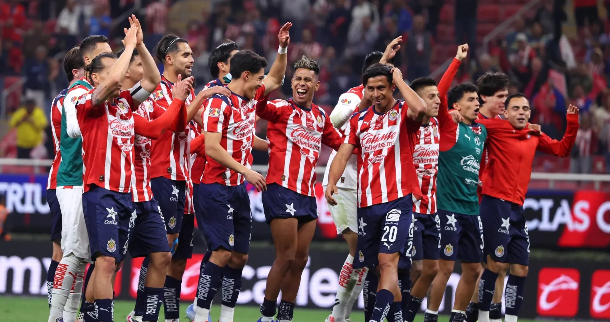 Chivas players celebrating after a match victory