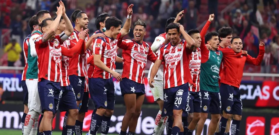 Chivas players celebrating after a match victory