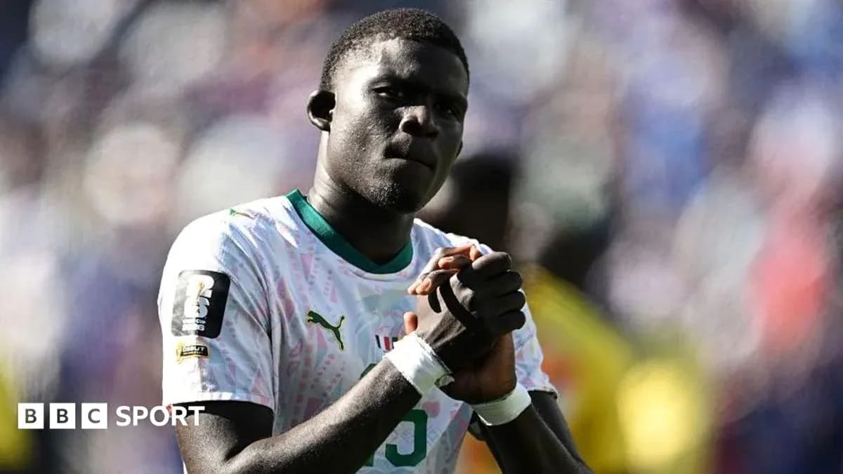 Player in national team jersey expressing determination