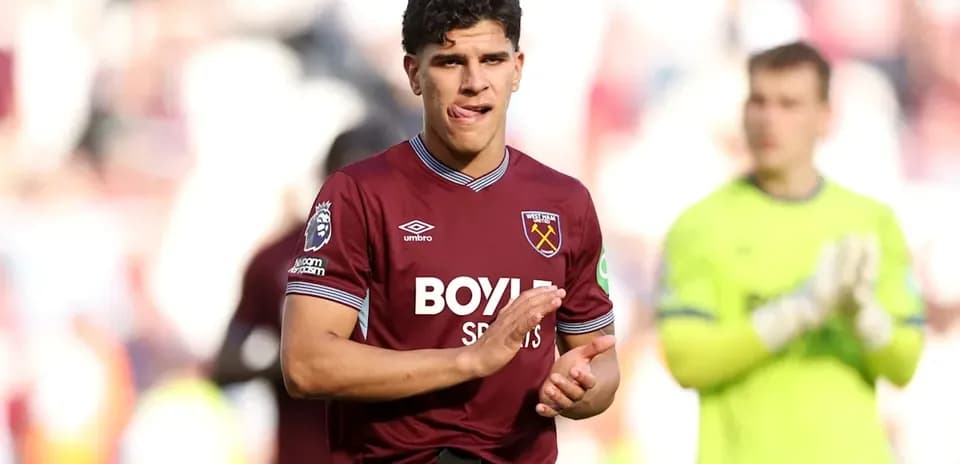 Player applauding fans after match in West Ham kit