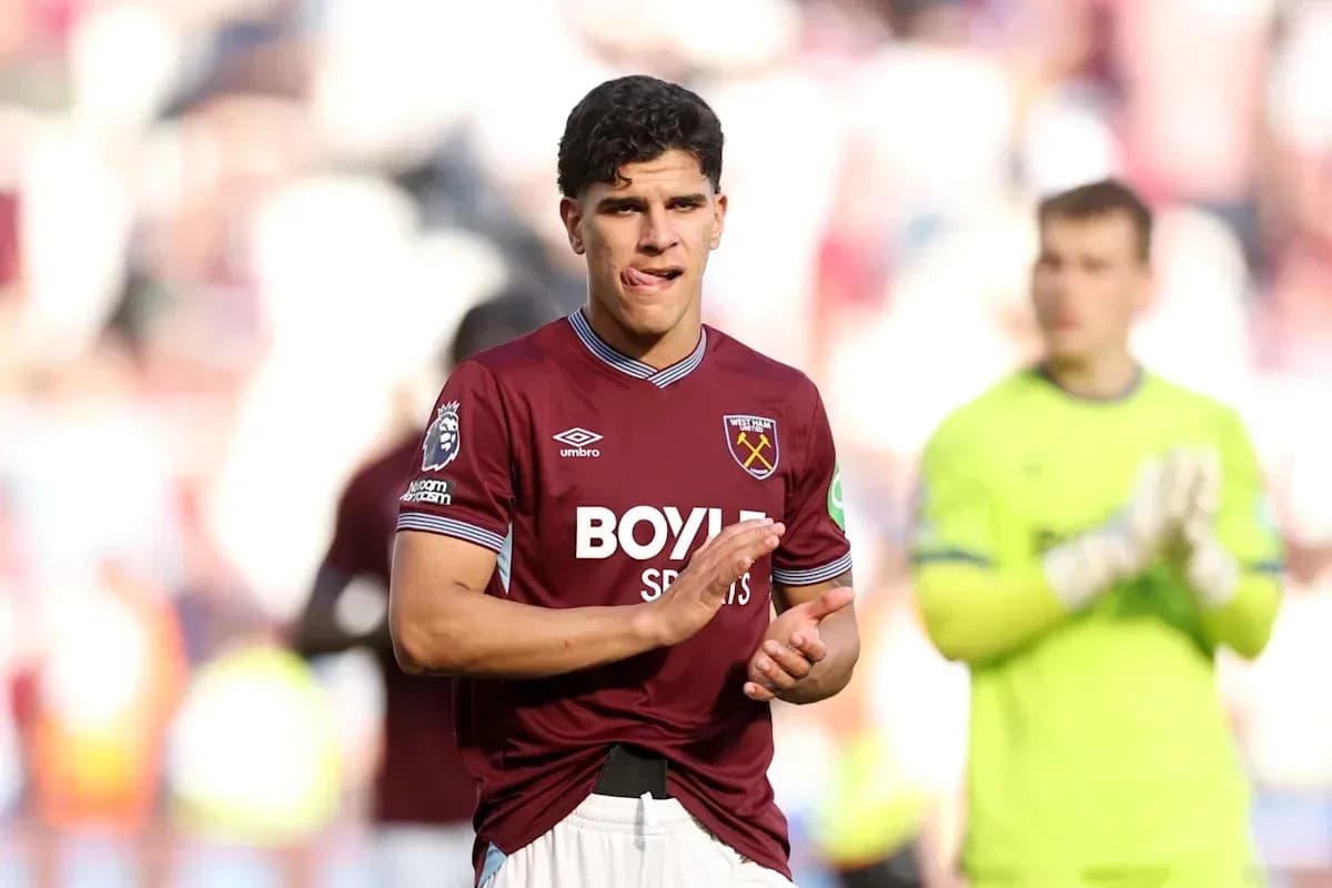 Player applauding fans after match in West Ham kit