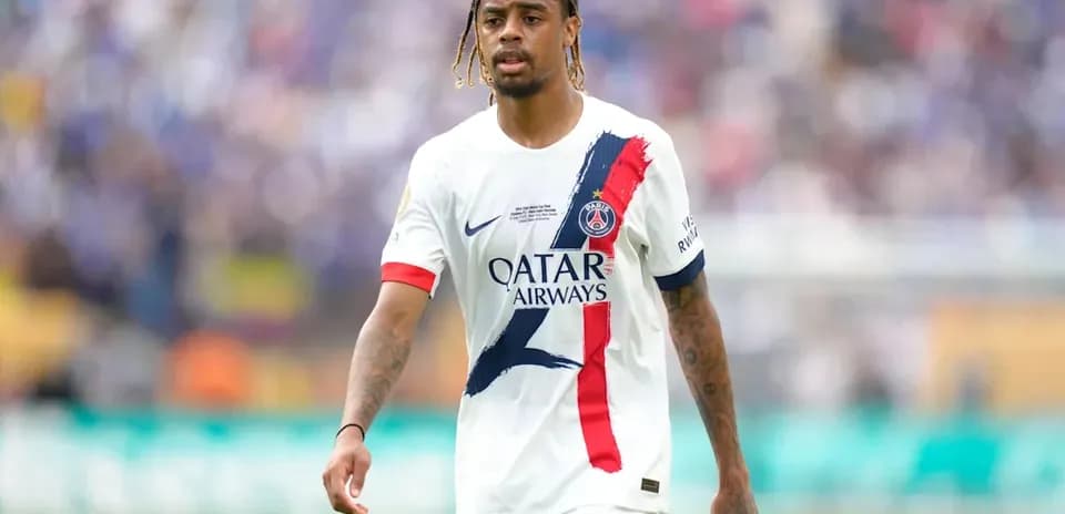 Player in PSG jersey walking on the field
