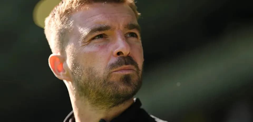 Man looking thoughtfully during a football match