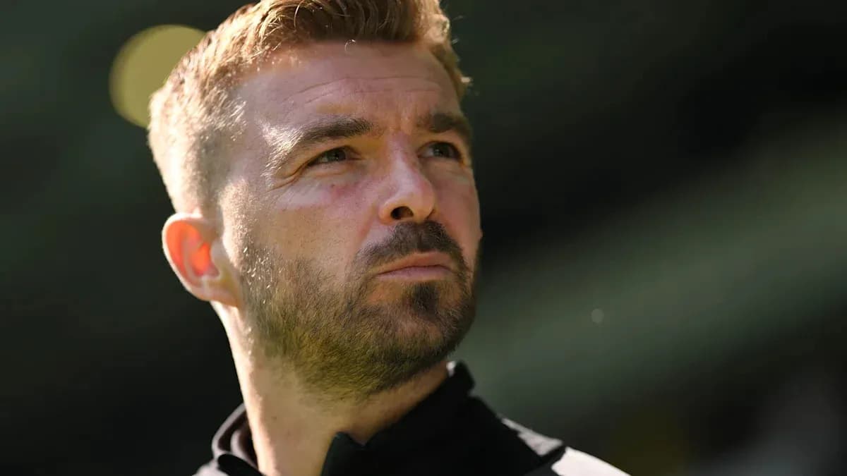 Man looking thoughtfully during a football match