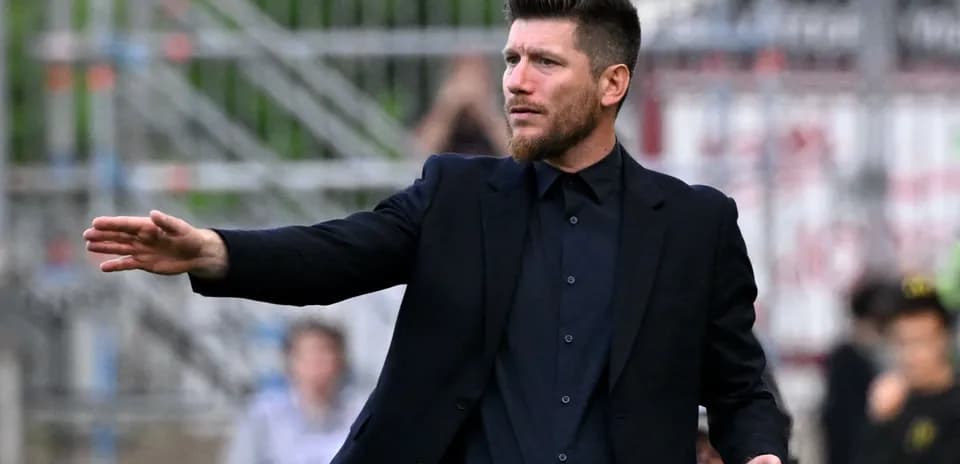 Coach directing players during a match