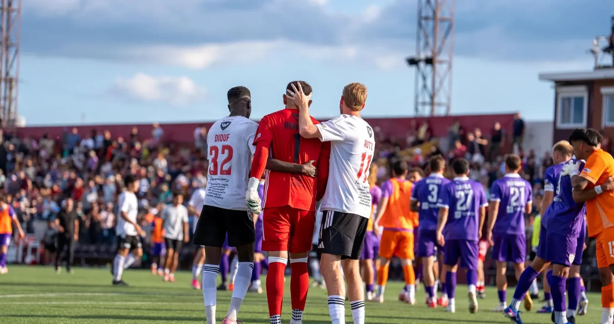 Players celebrating after a match conclusion