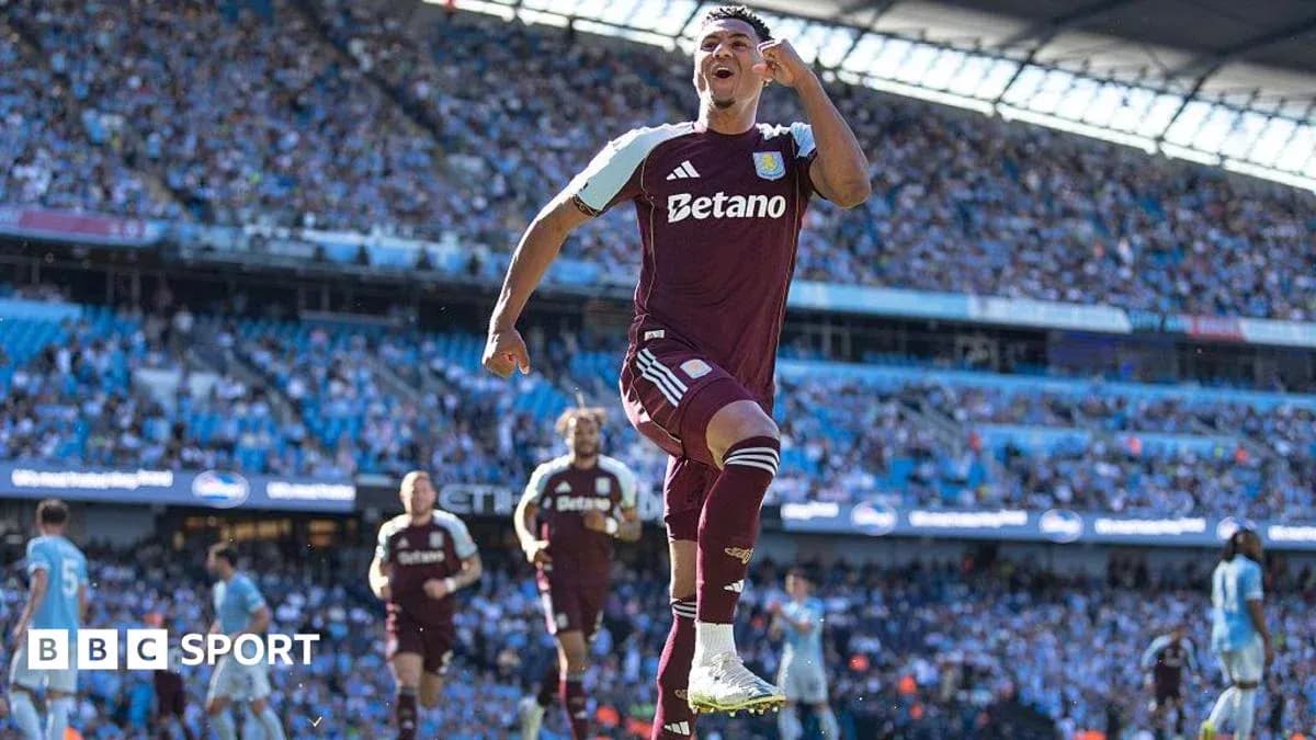 Aston Villa player celebrating a goal in stadium