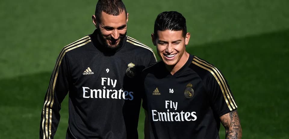Two players smiling during Real Madrid training session