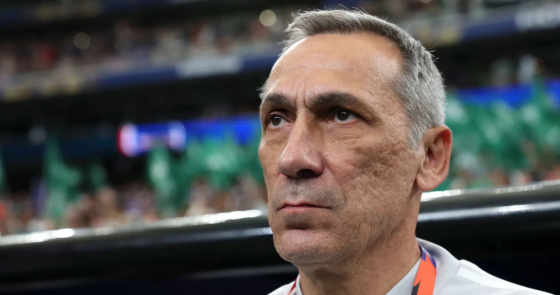 Coach observing the match from the sidelines