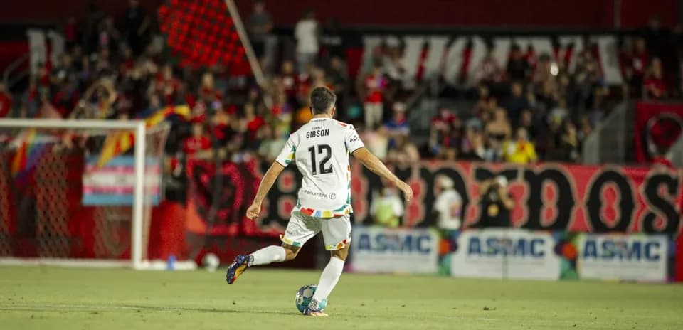 Player Gibson in action during match