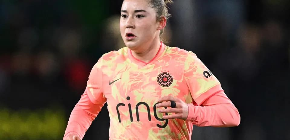 Player in pink jersey during match action