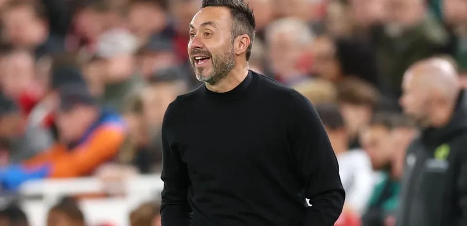 Coach reacting during a football match on the sidelines