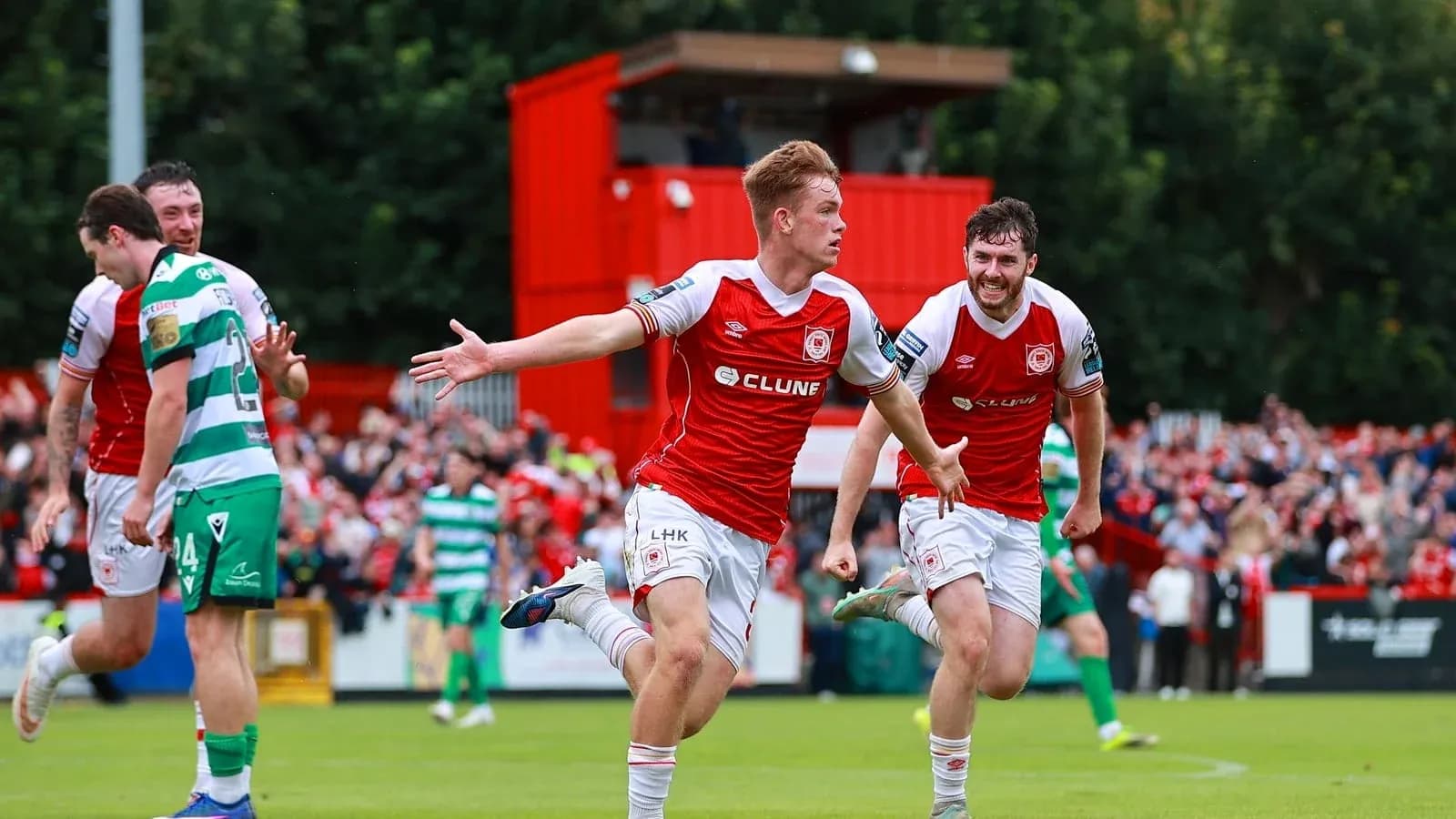 Player celebrating goal with teammates during match