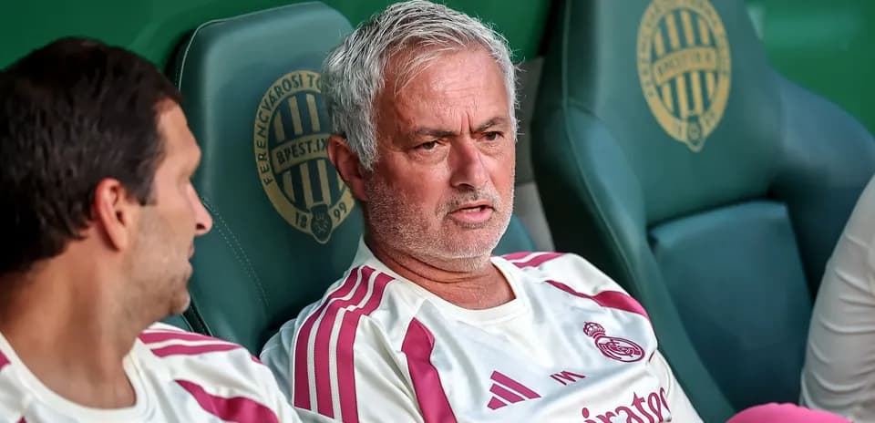 Coach discussing strategy on bench during match