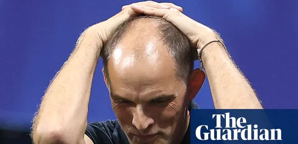 Coach holding his head in frustration during match