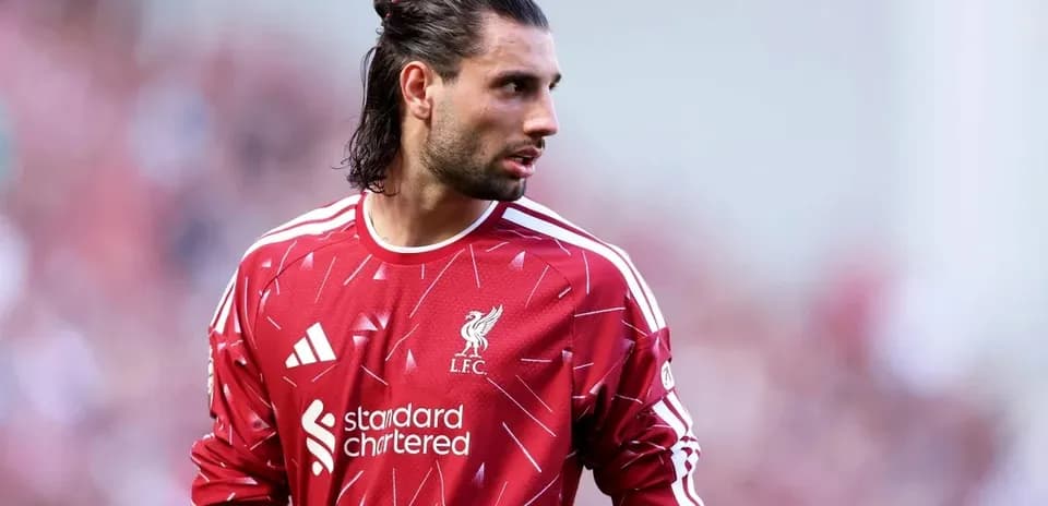 Goalkeeper in Liverpool jersey on the field