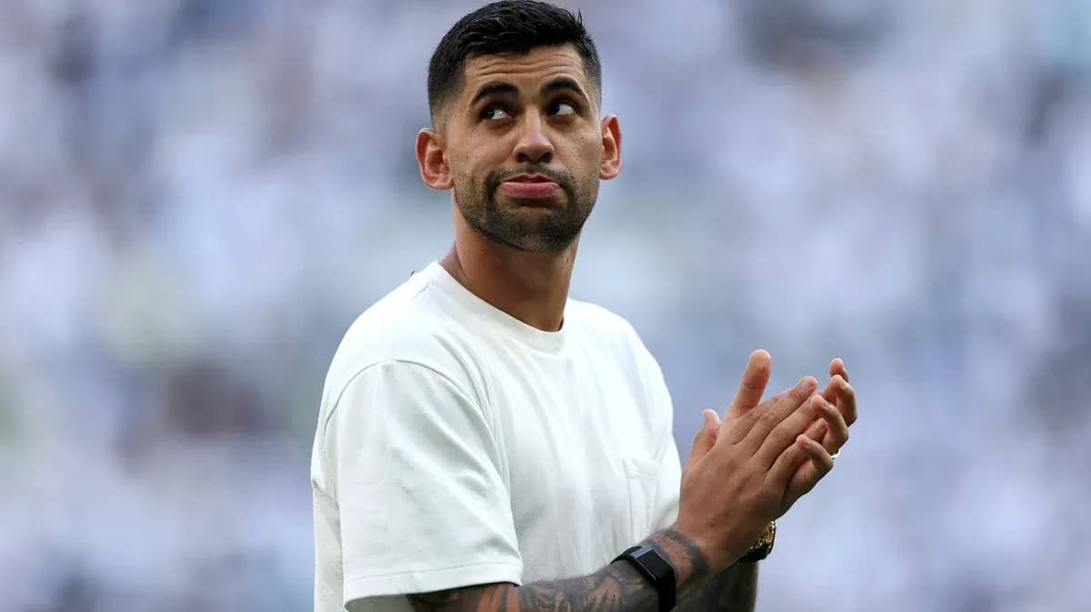 Player applauding in front of cheering crowd