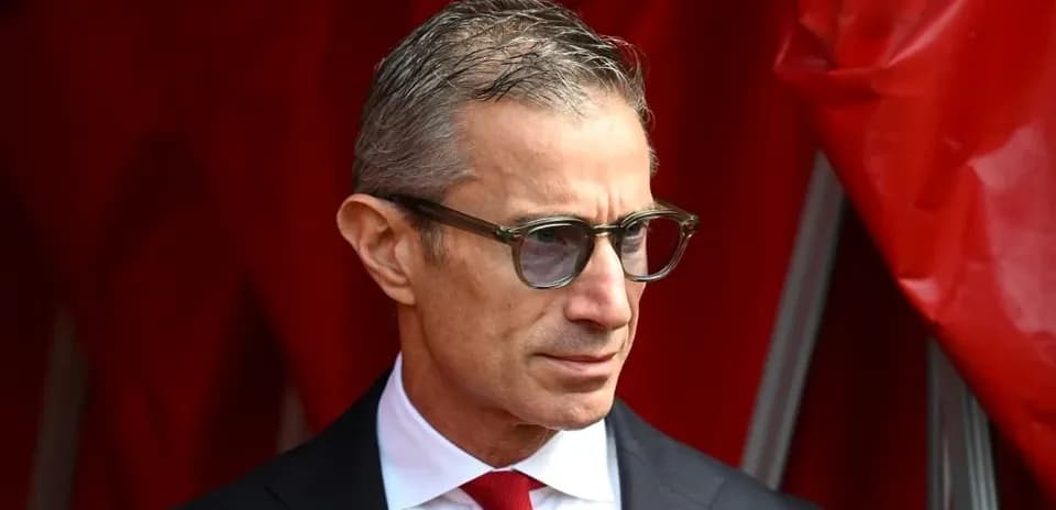 Man in glasses wearing a suit and tie