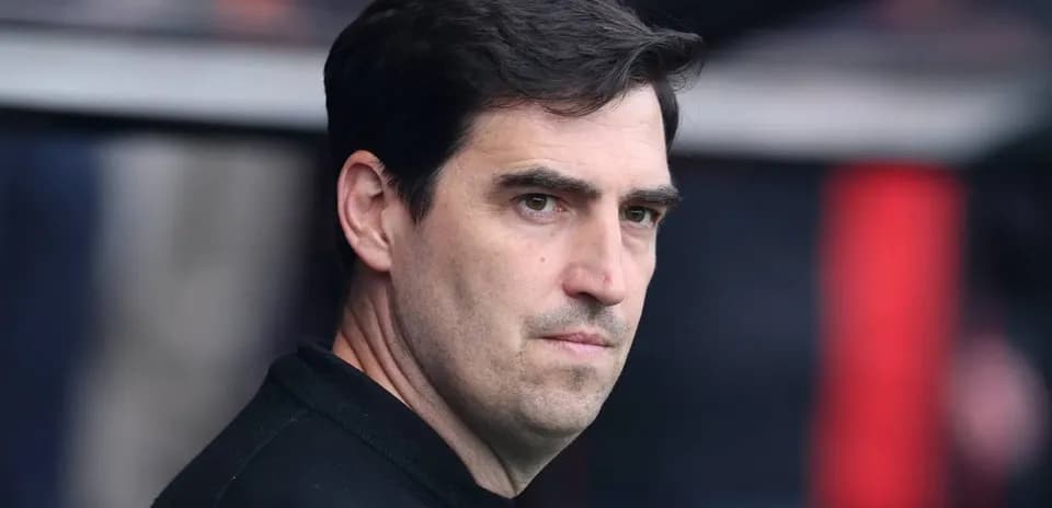 Coach observing the match from the sidelines