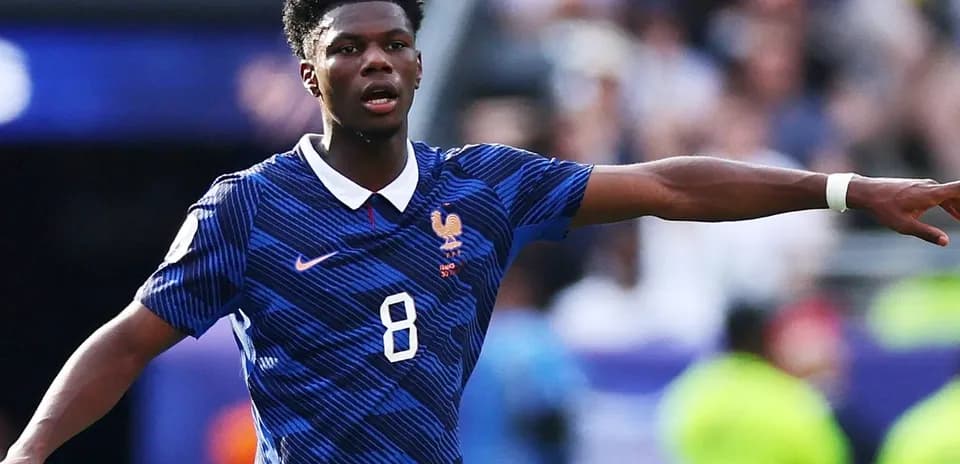 Player gesturing during match wearing France jersey